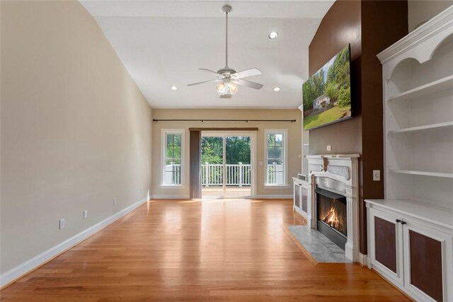204 Lakeside Dr, Walhalla, SC 29691 - unfurnished living room with light wood-type flooring, a fireplace with flush hearth, ceiling fan, baseboards, and recessed lighting