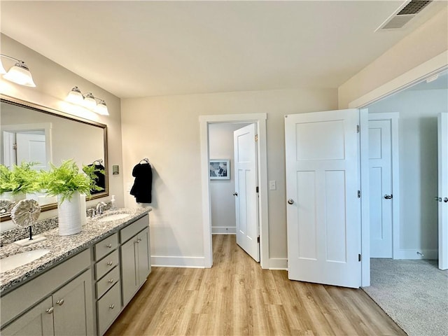 448 Seaborn Cir, Pendleton, SC 29670 - full bathroom with double vanity, wood finished floors, and baseboards