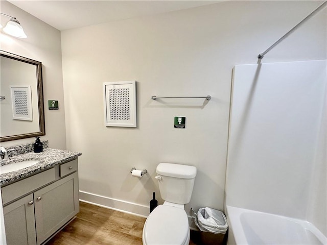 448 Seaborn Cir, Pendleton, SC 29670 - full bathroom with wood finished floors, toilet, vanity, baseboards, and tub / shower combination