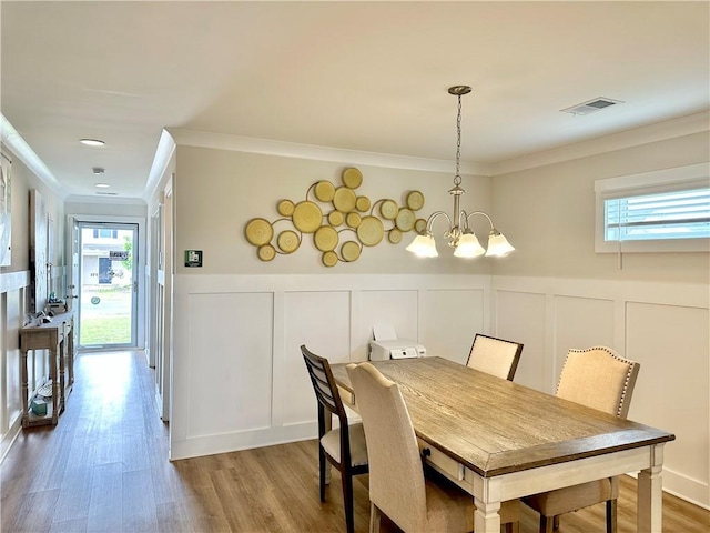 448 Seaborn Cir, Pendleton, SC 29670 - dining space featuring plenty of natural light, a decorative wall, crown molding, a chandelier, and wainscoting