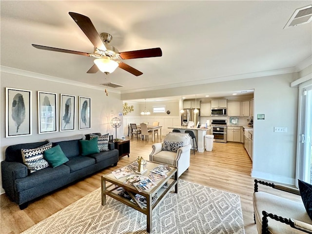 448 Seaborn Cir, Pendleton, SC 29670 - living area featuring light wood finished floors, ornamental molding, and a ceiling fan