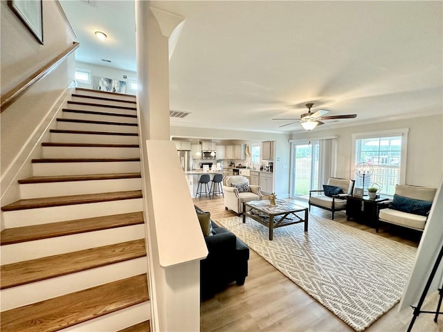 448 Seaborn Cir, Pendleton, SC 29670 - living area featuring light wood-type flooring, ceiling fan, and stairway