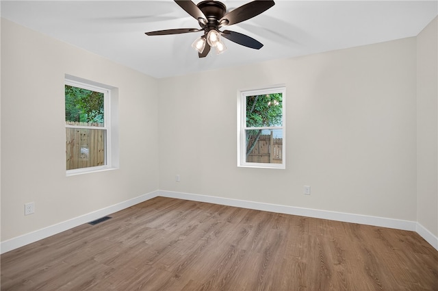 1103 Scott Dr, Anderson, SC 29625 - empty room featuring healthy amount of natural light, wood finished floors, and ceiling fan