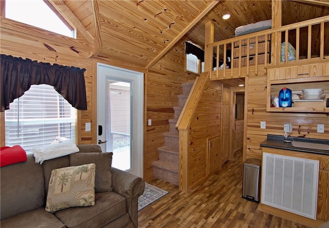 669 N Fleetwood Ln, Fair Play, SC 29643 - living room featuring wooden ceiling, wood walls, stairway, wood finished floors, and high vaulted ceiling