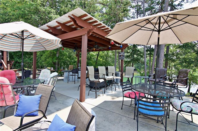 669 N Fleetwood Ln, Fair Play, SC 29643 - view of patio with outdoor dining space and view of wooded area