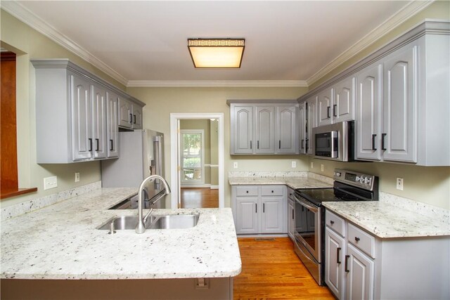 104 Tinsley Dr, Anderson, SC 29621 - kitchen featuring appliances with stainless steel finishes, a sink, a peninsula, gray cabinets, and crown molding