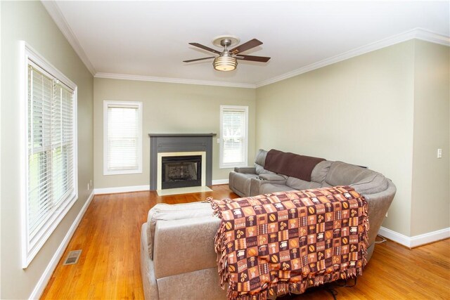 104 Tinsley Dr, Anderson, SC 29621 - living area with wood finished floors, a ceiling fan, plenty of natural light, and ornamental molding