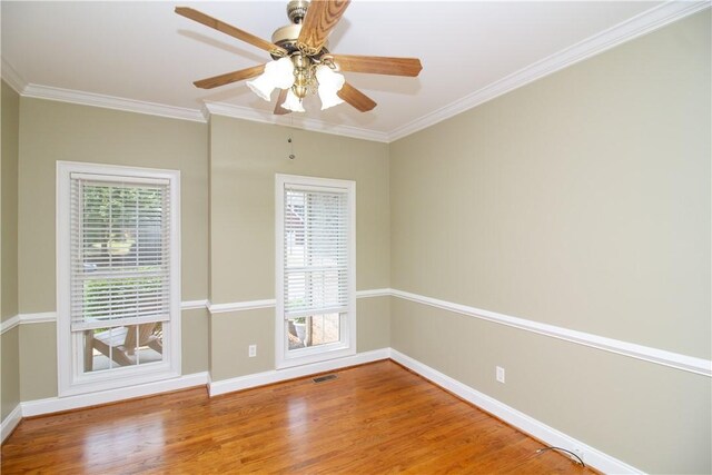 104 Tinsley Dr, Anderson, SC 29621 - empty room with healthy amount of natural light, wood finished floors, baseboards, and ornamental molding