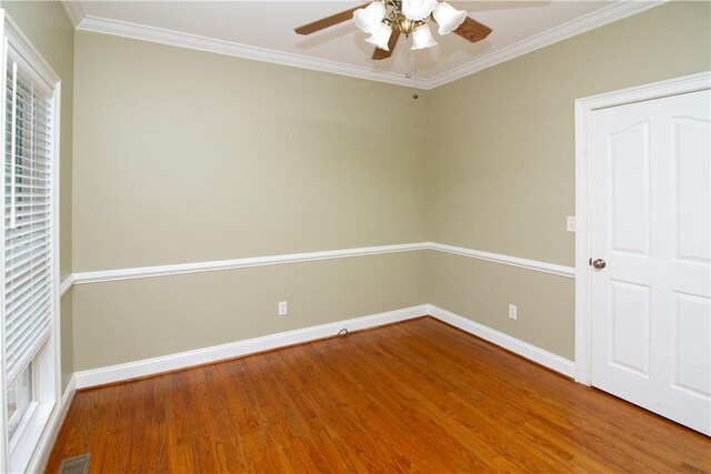 104 Tinsley Dr, Anderson, SC 29621 - spare room featuring wood finished floors, a ceiling fan, baseboards, and crown molding