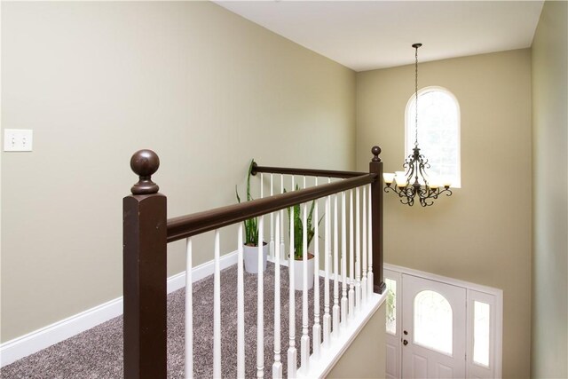 104 Tinsley Dr, Anderson, SC 29621 - staircase featuring a chandelier, carpet, and baseboards