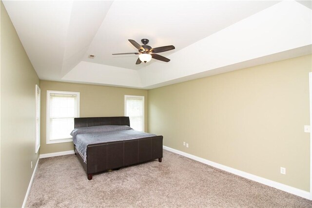 104 Tinsley Dr, Anderson, SC 29621 - bedroom with a tray ceiling, light carpet, and baseboards