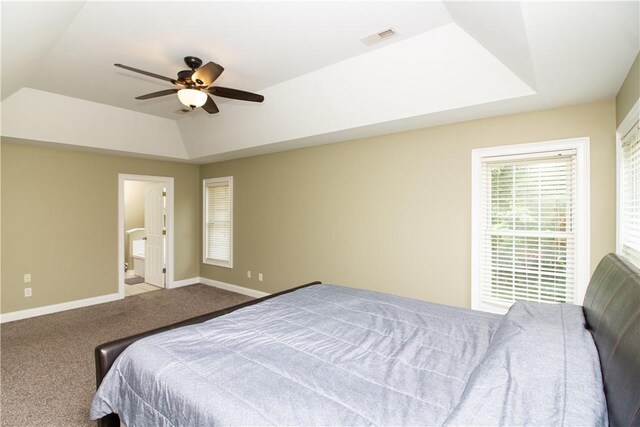104 Tinsley Dr, Anderson, SC 29621 - carpeted bedroom featuring baseboards, a tray ceiling, ceiling fan, ensuite bathroom, and vaulted ceiling