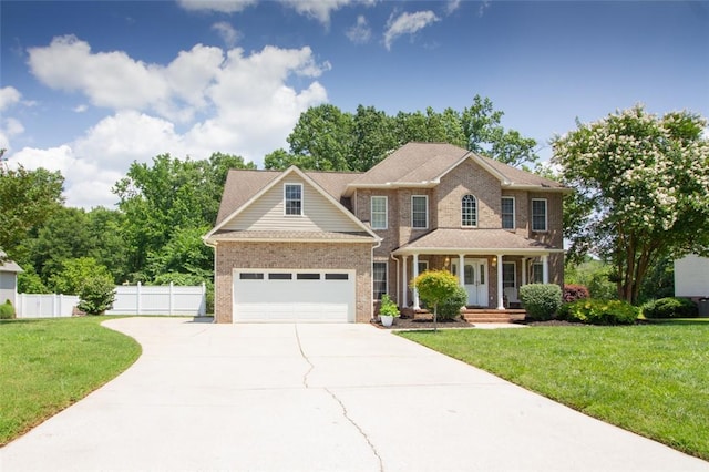104 Tinsley Dr, Anderson, SC 29621 - colonial inspired home with driveway, a porch, an attached garage, and brick siding
