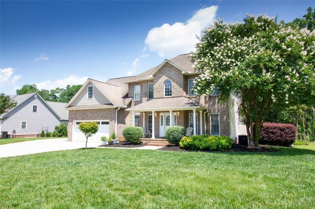 104 Tinsley Dr, Anderson, SC 29621 - view of front of house featuring brick siding, concrete driveway, and a front yard