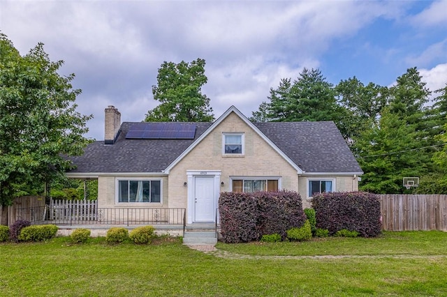 6913 White Horse Rd, Greenville, SC 29611 - view of front of home featuring solar panels, a chimney, roof with shingles, and brick siding