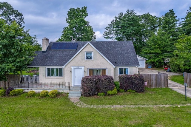 6913 White Horse Rd, Greenville, SC 29611 - view of front of home featuring a chimney, solar panels, and a shingled roof
