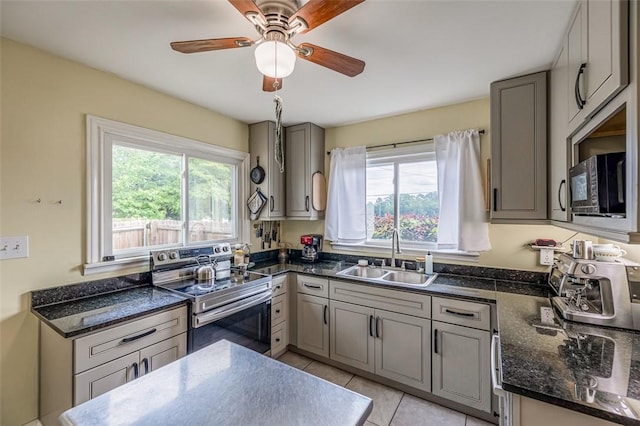 6913 White Horse Rd, Greenville, SC 29611 - kitchen with stainless steel electric range, a sink, black microwave, and healthy amount of natural light