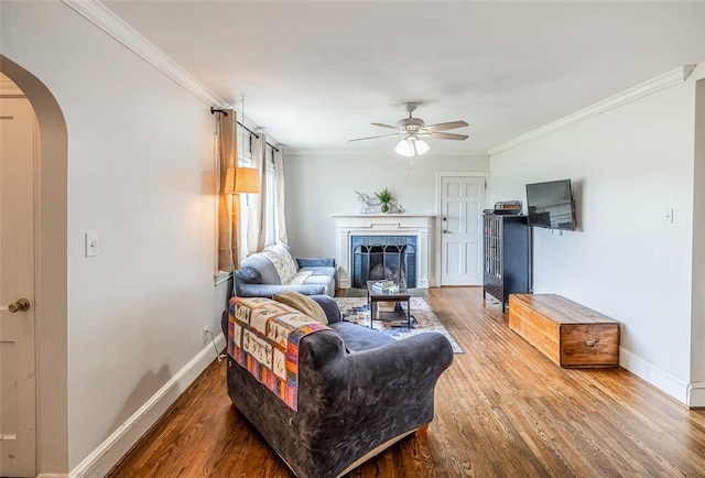 6913 White Horse Rd, Greenville, SC 29611 - living room featuring arched walkways, a ceiling fan, wood finished floors, baseboards, and ornamental molding