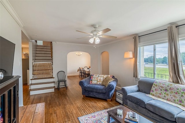 6913 White Horse Rd, Greenville, SC 29611 - living area with arched walkways, stairway, ornamental molding, wood finished floors, and a ceiling fan