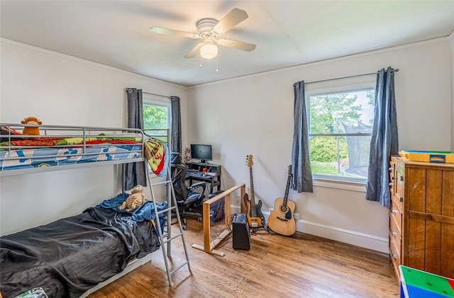 6913 White Horse Rd, Greenville, SC 29611 - bedroom with wood finished floors, ornamental molding, ceiling fan, and baseboards
