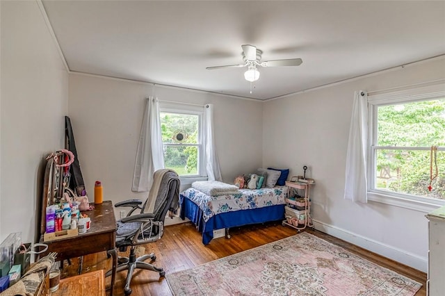 6913 White Horse Rd, Greenville, SC 29611 - bedroom featuring wood finished floors, an office area, ornamental molding, ceiling fan, and baseboards