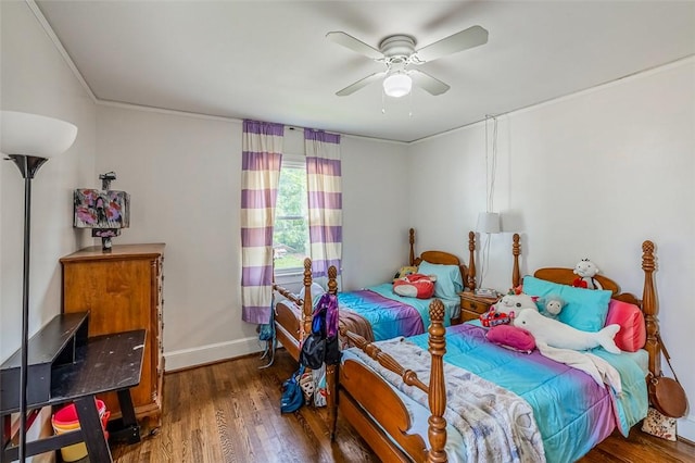 6913 White Horse Rd, Greenville, SC 29611 - bedroom featuring wood finished floors, baseboards, ornamental molding, and a ceiling fan