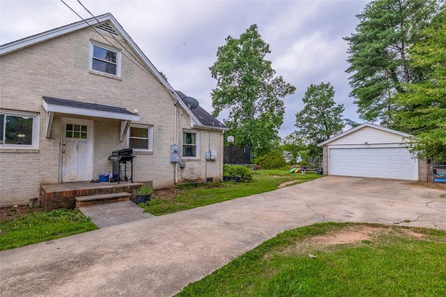 6913 White Horse Rd, Greenville, SC 29611 - view of property exterior with a trampoline, an outdoor structure, a lawn, a detached garage, and brick siding