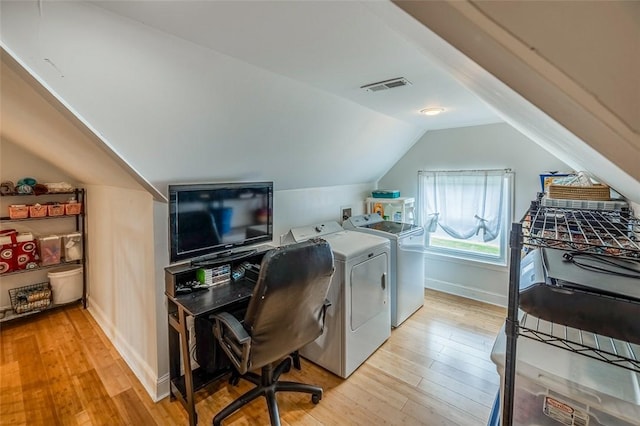 6913 White Horse Rd, Greenville, SC 29611 - office area featuring washer and dryer, light wood finished floors, lofted ceiling, and baseboards