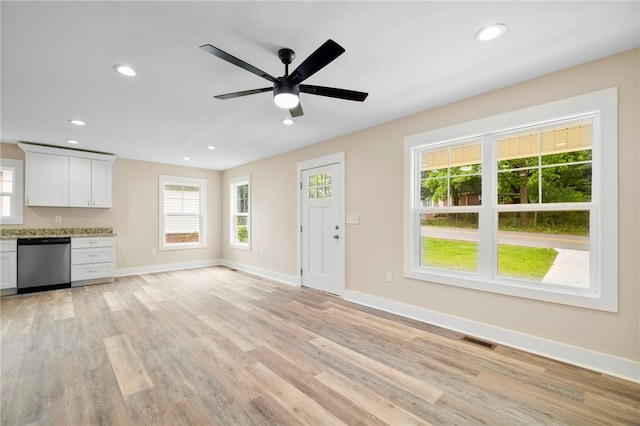 1205 W Franklin St, Anderson, SC 29624 - unfurnished living room with plenty of natural light, light wood-type flooring, baseboards, and recessed lighting