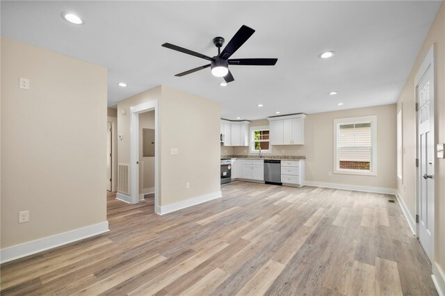 1205 W Franklin St, Anderson, SC 29624 - unfurnished living room with light wood-type flooring, ceiling fan, baseboards, and recessed lighting