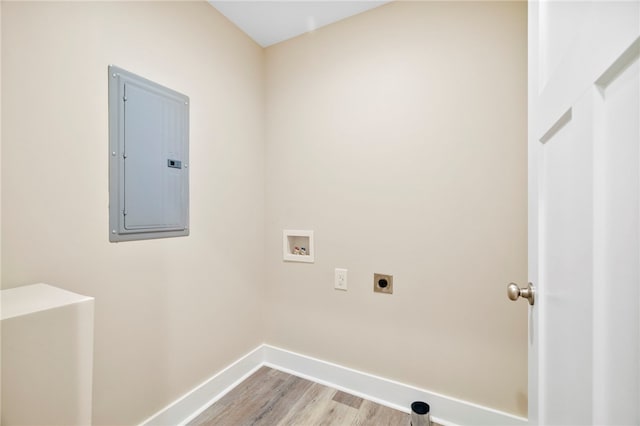 1205 W Franklin St, Anderson, SC 29624 - washroom featuring electric panel, hookup for an electric dryer, washer hookup, baseboards, and light wood-type flooring