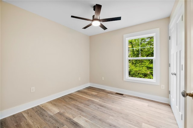1205 W Franklin St, Anderson, SC 29624 - empty room featuring light wood-style flooring, baseboards, and a ceiling fan