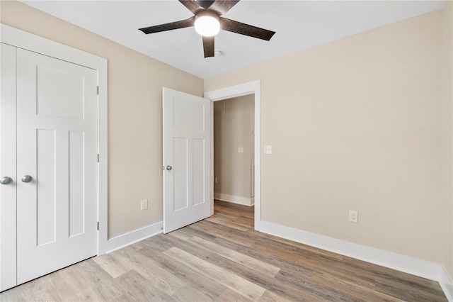 1205 W Franklin St, Anderson, SC 29624 - unfurnished bedroom with wood finished floors, baseboards, and ceiling fan