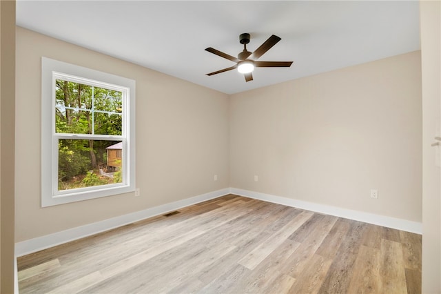 1205 W Franklin St, Anderson, SC 29624 - spare room featuring light wood-style floors, a ceiling fan, and baseboards