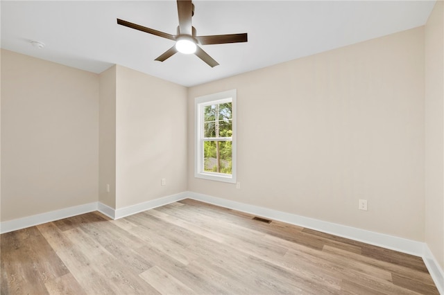 1205 W Franklin St, Anderson, SC 29624 - empty room with ceiling fan, light wood-type flooring, and baseboards
