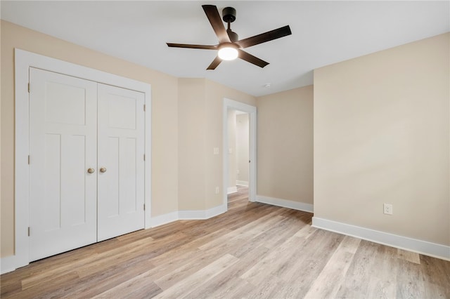 1205 W Franklin St, Anderson, SC 29624 - unfurnished bedroom with light wood finished floors, baseboards, a closet, and ceiling fan