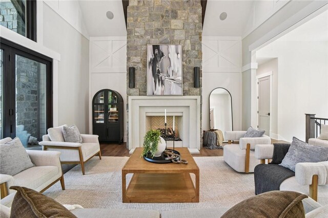221 Hermitage Dr, Six Mile, SC 29682 - living room featuring a large fireplace, high vaulted ceiling, and wood finished floors
