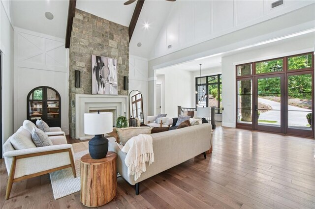 221 Hermitage Dr, Six Mile, SC 29682 - living room featuring high vaulted ceiling, wood finished floors, ceiling fan, a fireplace, and beam ceiling