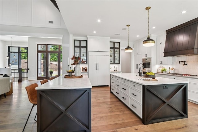 221 Hermitage Dr, Six Mile, SC 29682 - kitchen with paneled built in refrigerator, oven, a spacious island, backsplash, and gas cooktop