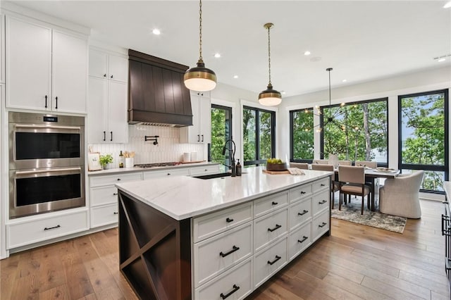 221 Hermitage Dr, Six Mile, SC 29682 - kitchen featuring double oven, a sink, custom range hood, gas cooktop, and recessed lighting
