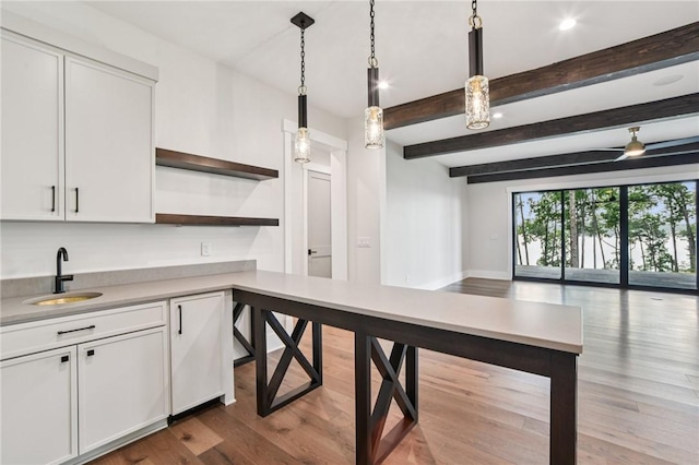 221 Hermitage Dr, Six Mile, SC 29682 - kitchen with a sink, open shelves, light countertops, open floor plan, and white cabinetry