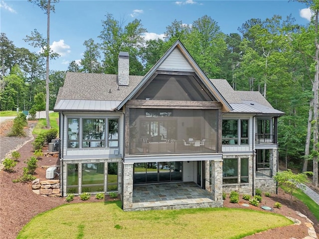 221 Hermitage Dr, Six Mile, SC 29682 - rear view of house with a patio, a standing seam roof, a sunroom, a chimney, and metal roof