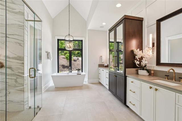 221 Hermitage Dr, Six Mile, SC 29682 - full bathroom featuring a marble finish shower, vanity, a soaking tub, baseboards, and lofted ceiling