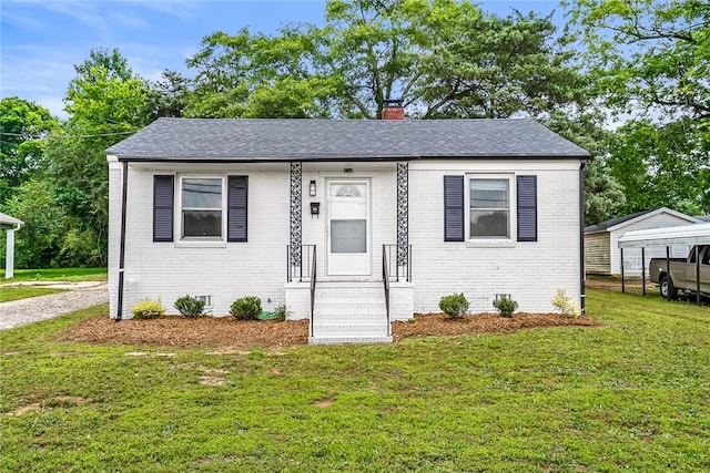 710 Greenville St, Pendleton, SC 29670 - bungalow featuring brick siding, a chimney, a front lawn, and entry steps