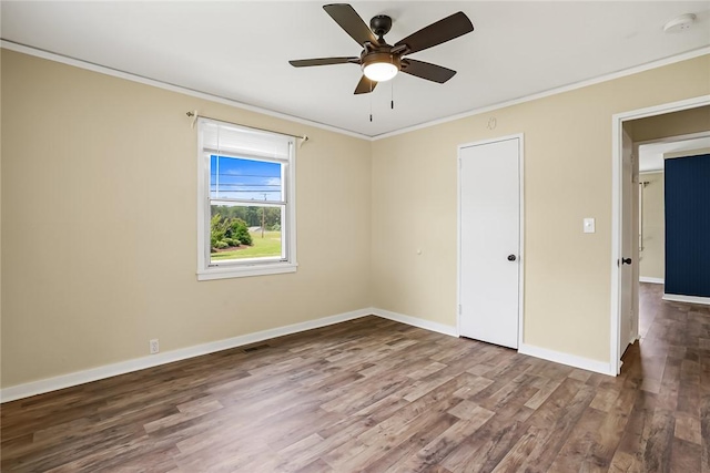 710 Greenville St, Pendleton, SC 29670 - empty room featuring crown molding, wood finished floors, ceiling fan, baseboards, and a smoke detector
