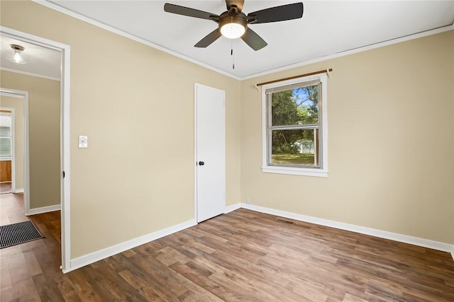 710 Greenville St, Pendleton, SC 29670 - spare room with crown molding, baseboards, wood finished floors, and a ceiling fan