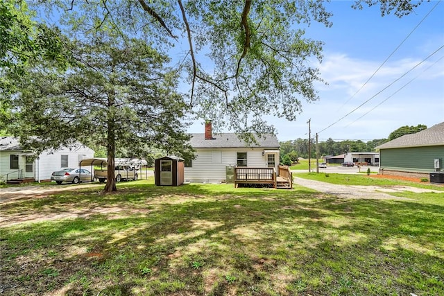 710 Greenville St, Pendleton, SC 29670 - view of green lawn featuring a wooden deck, central AC unit, and a detached carport