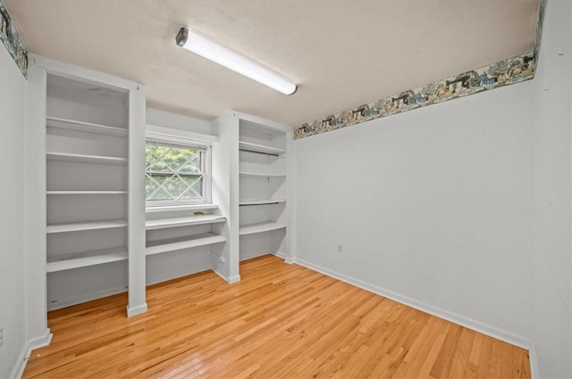 100 Colonial Ct, West Union, SC 29696 - unfurnished bedroom featuring wood finished floors, two closets, and baseboards