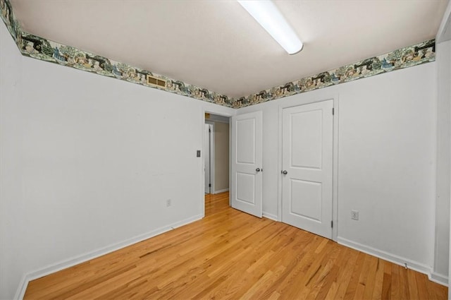 100 Colonial Ct, West Union, SC 29696 - unfurnished bedroom featuring light wood-style floors, baseboards, and a closet