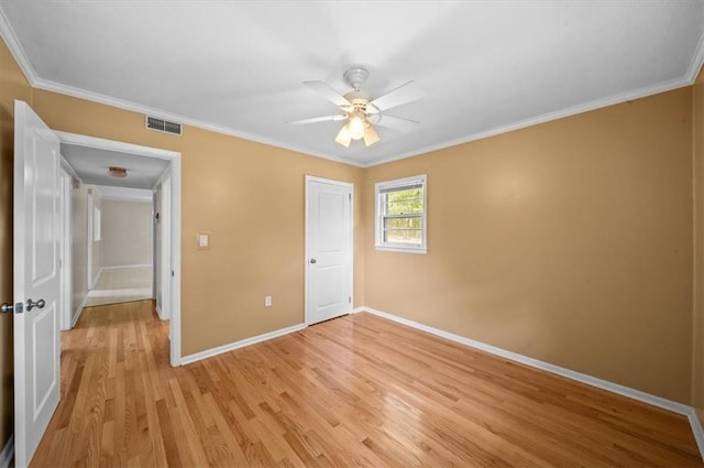 100 Colonial Ct, West Union, SC 29696 - unfurnished bedroom with baseboards, light wood-style flooring, ornamental molding, ceiling fan, and a closet